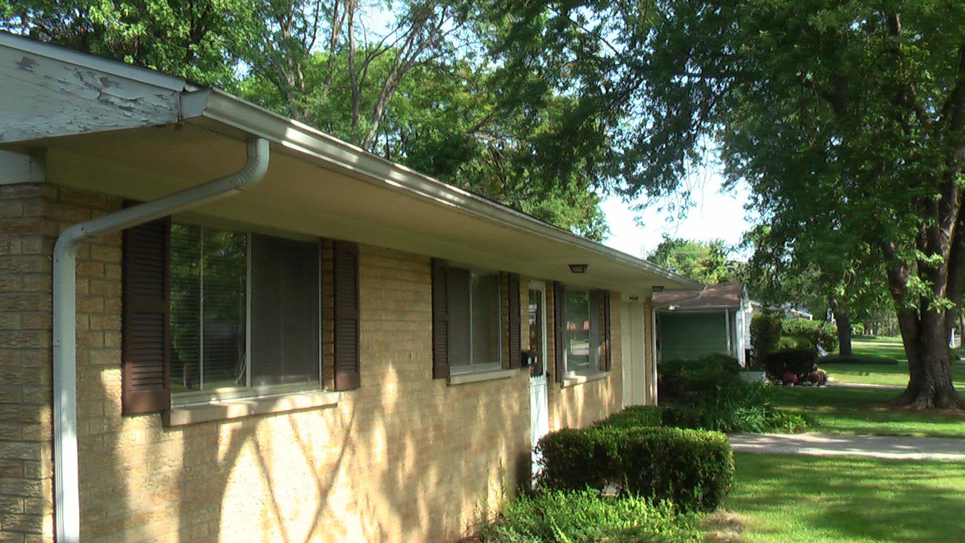 Gutter work on a brick ranch
