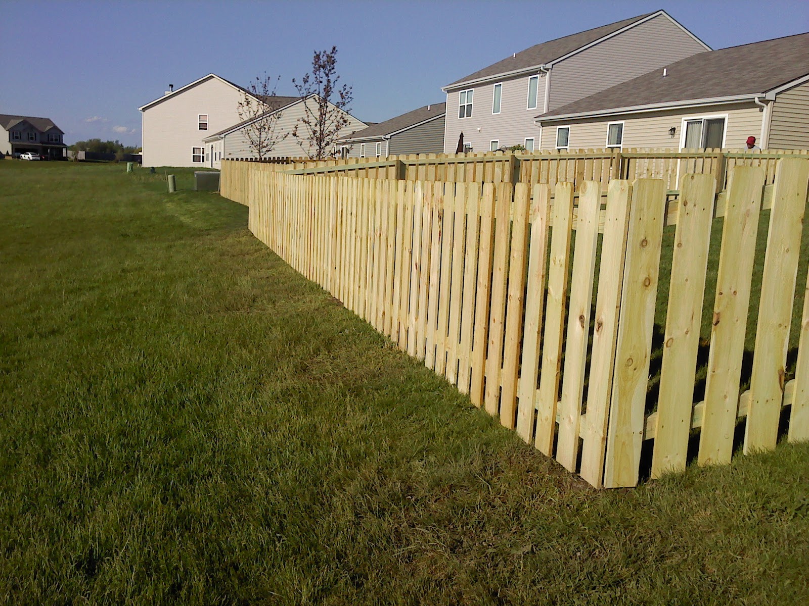 New cedar fence built by Honorable Home Repairs at sunset