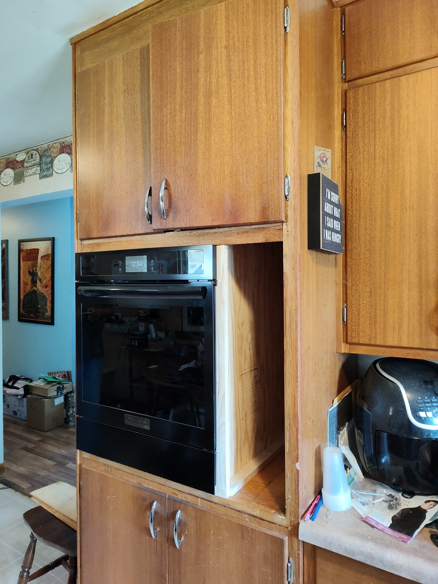New wall oven installed and fitted into the reworked cabinet